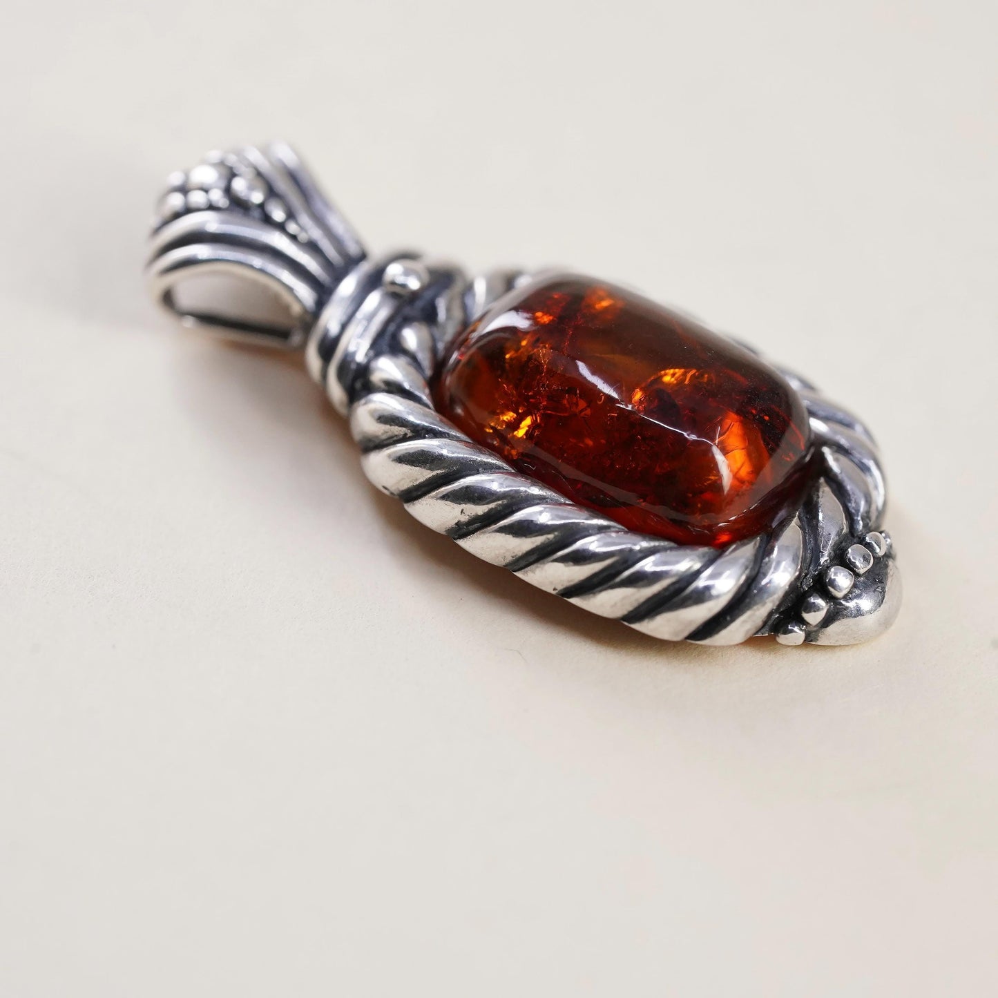 Vintage Sterling 925 silver handmade pendant with amber and cable around