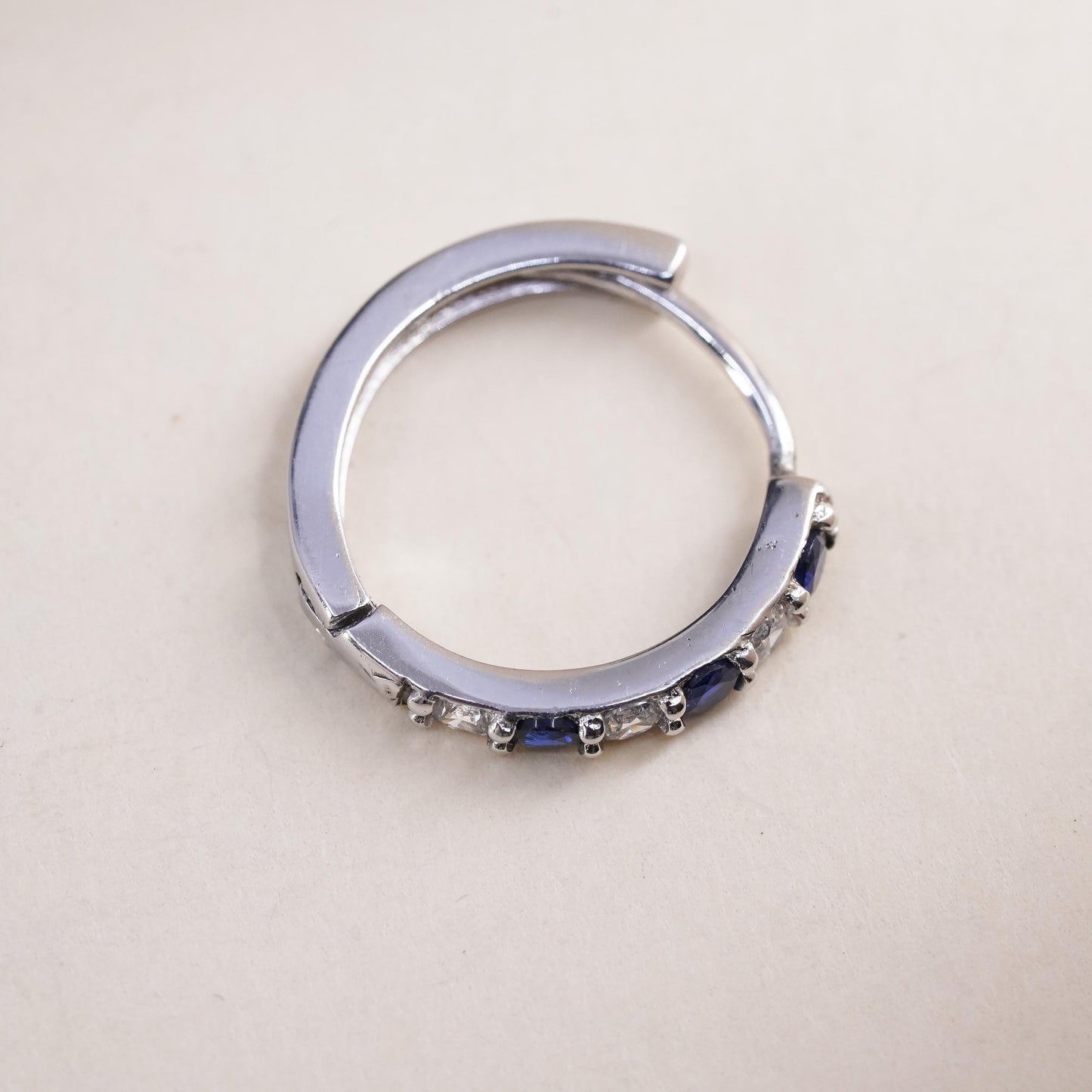 0.75”, sterling silver single earring, 925 huggie hoop with sapphire and cz