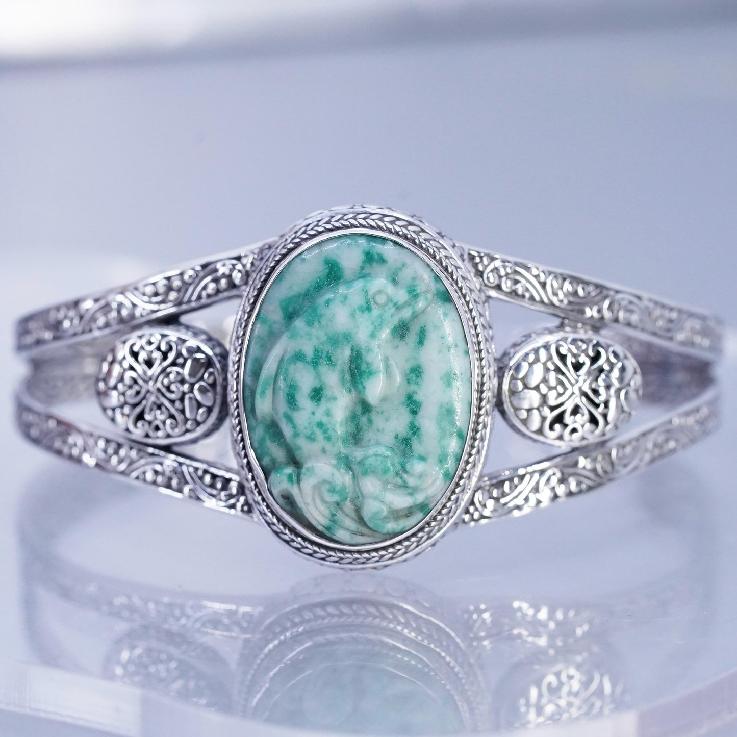 7.5”, Navajo Sandra Sterling 925 silver bracelet, cuff carved dolphin jade