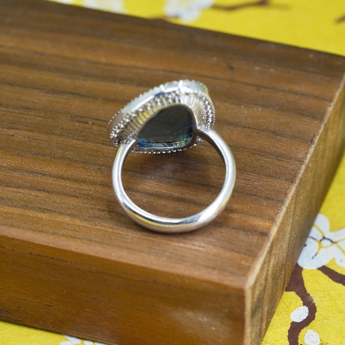 Size 7.25, vintage Sterling 925 silver ring with blue crystal and cz around