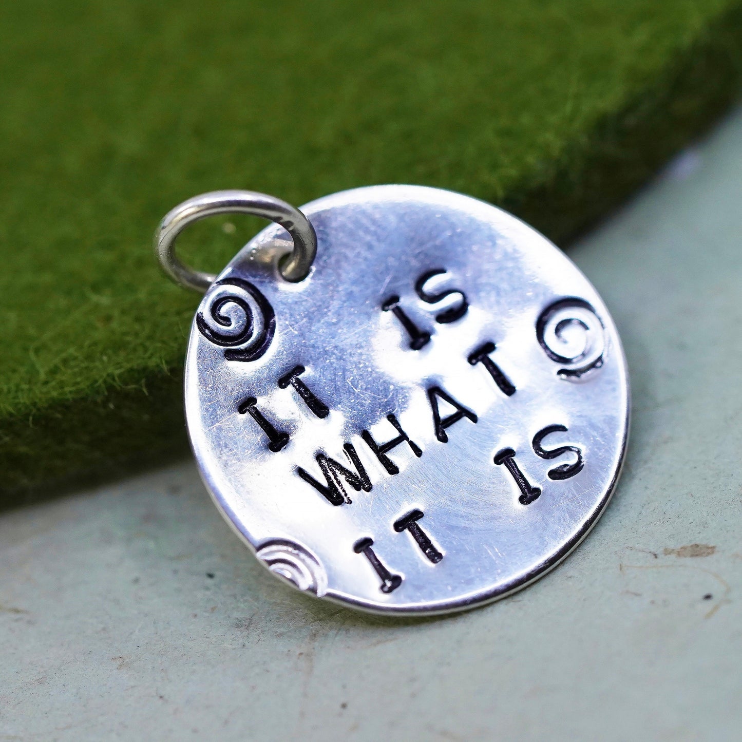 sterling silver handmade pendant, circle tag charm embossed “it is what it is”
