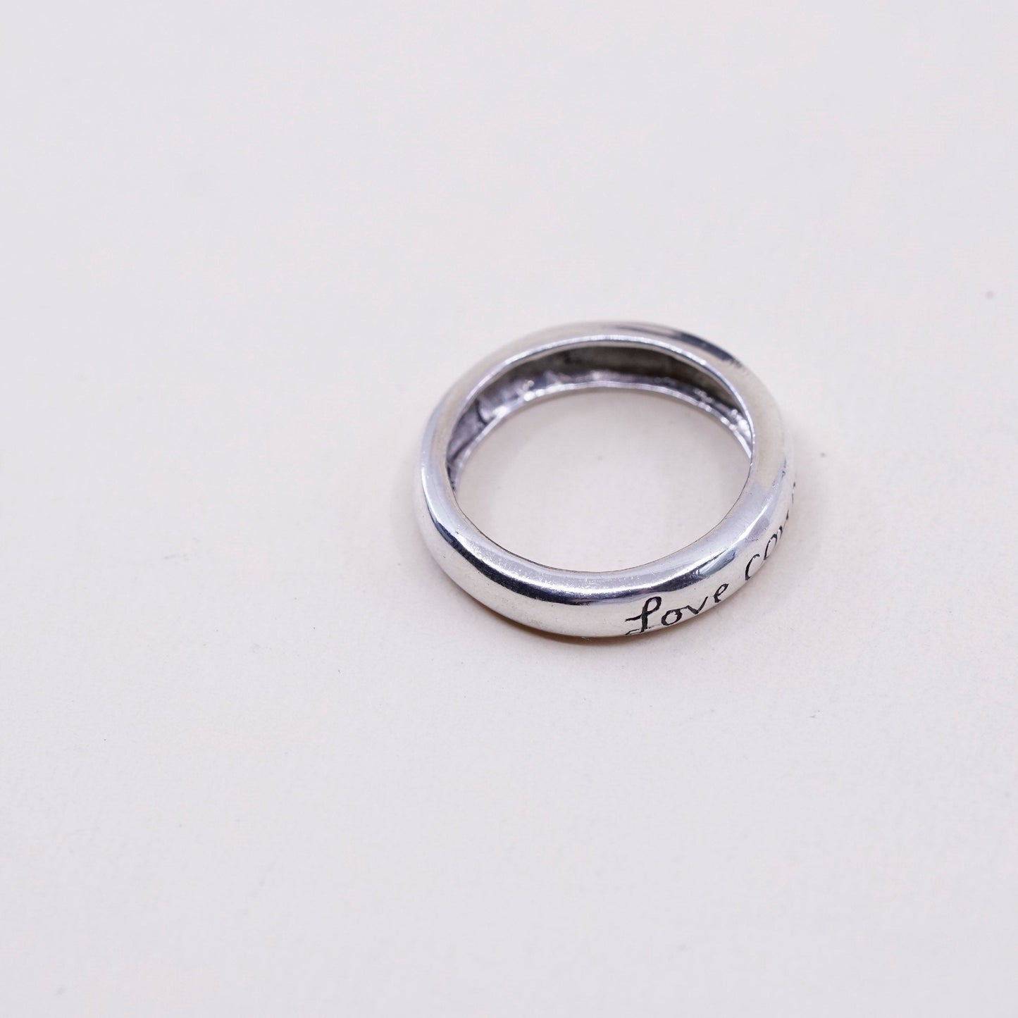 sz 7.75, vtg sterling silver handmade ring, 925 quote band “love conquers