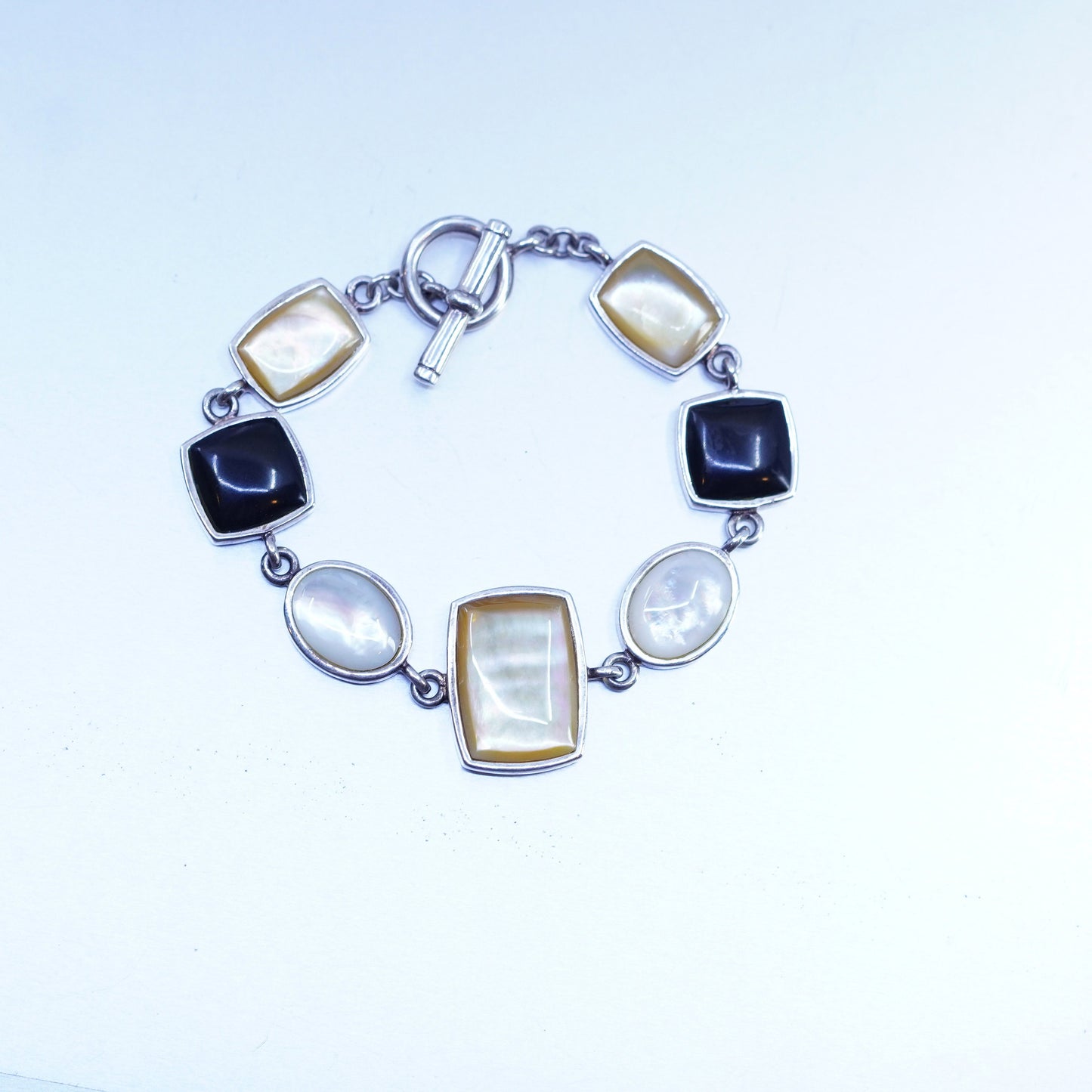 6.75”, VTG sterling 925 silver bracelet w/ black onyx golden mother of pearl