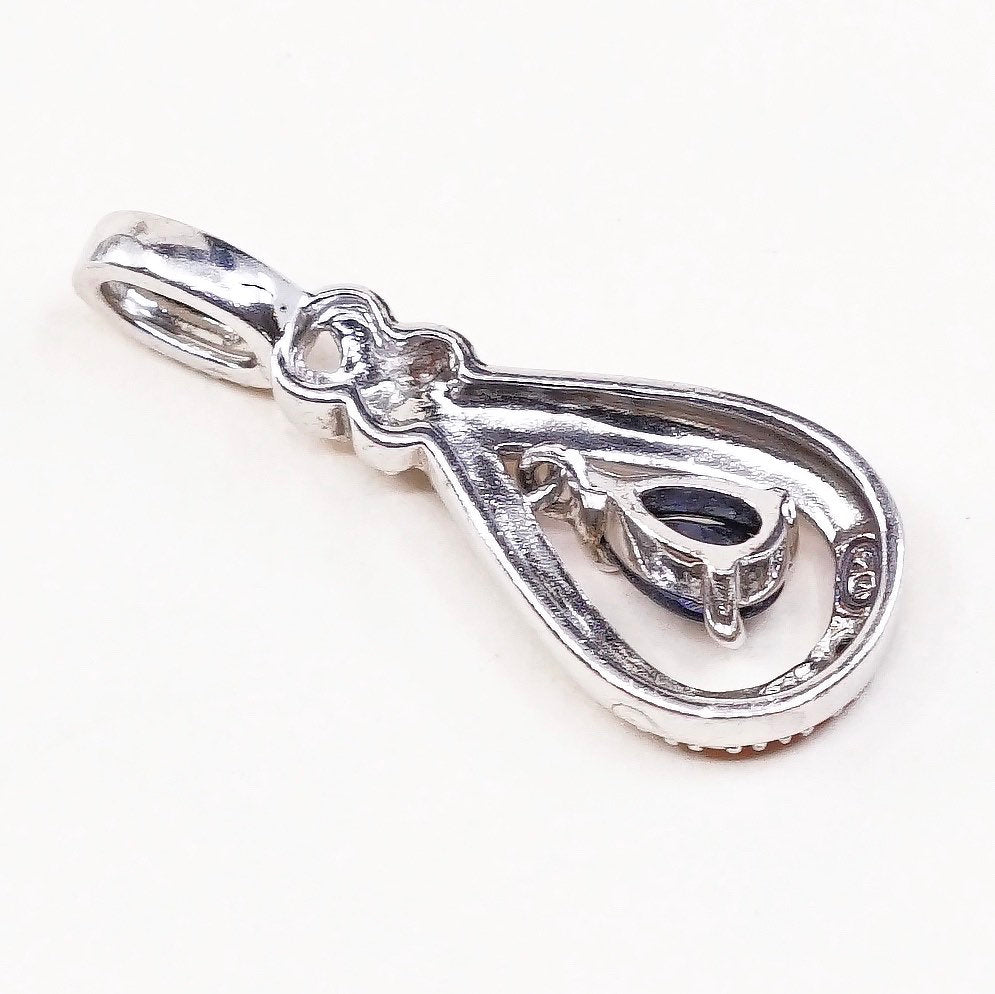 Sterling silver pendant with teardrop shaped sapphire, crystal around