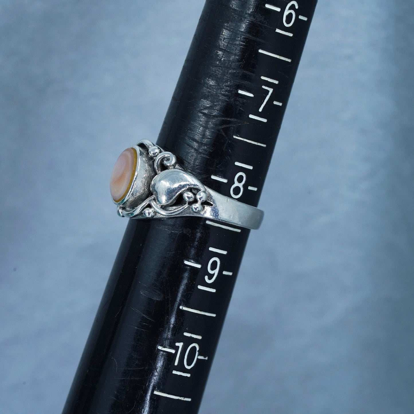 Size 8.25, Sterling 925 silver ring with pink mother of pearl and hearts around