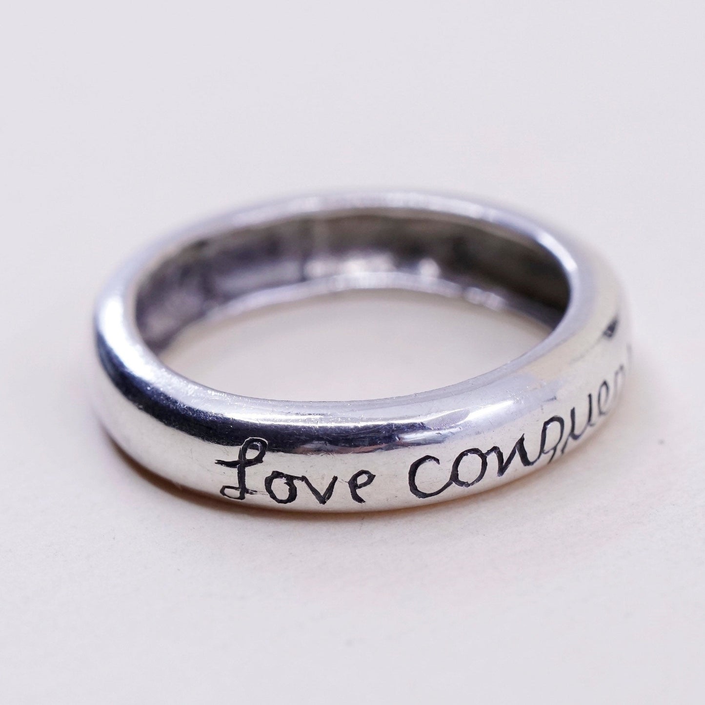 sz 7.75, vtg sterling silver handmade ring, 925 quote band “love conquers