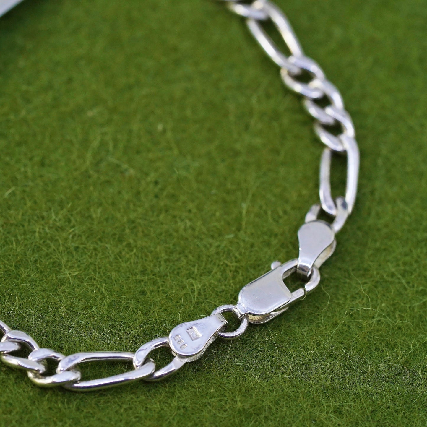 7.25” sterling silver bracelet, 925 figaro chain with line engraved bar tag