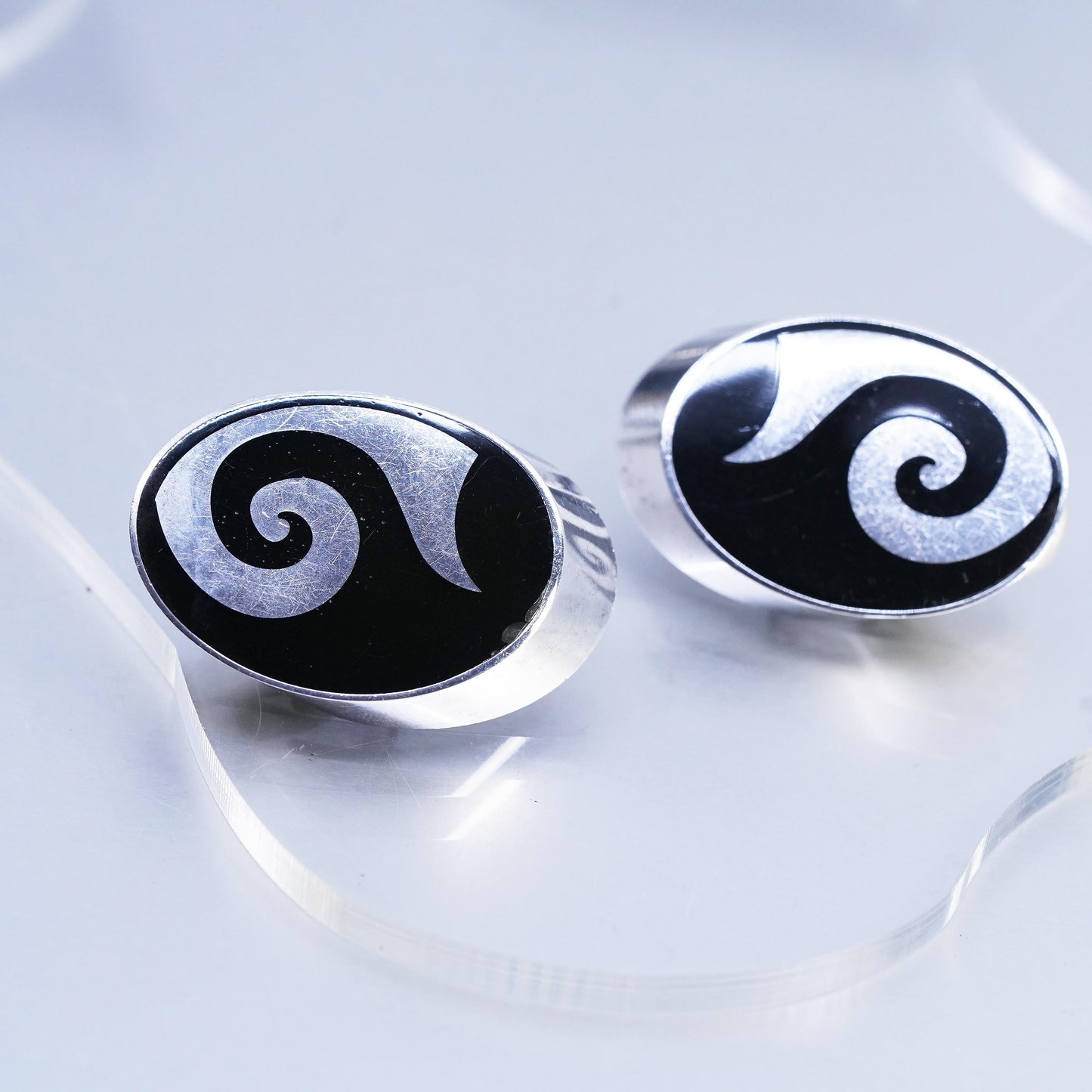 Vintage Varga Sterling Silver Oval Clip On Earrings with onyx and spiral inlay