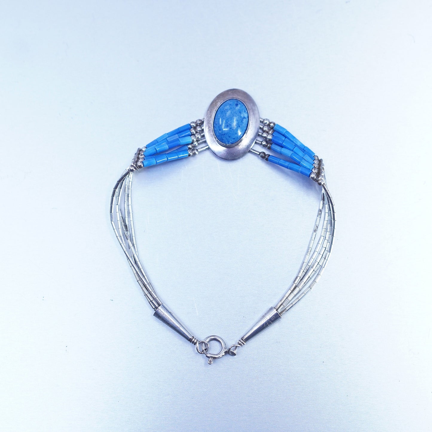 7.25”, Sterling 925 silver bracelet, liquid chain with denim lapis lazuli charm
