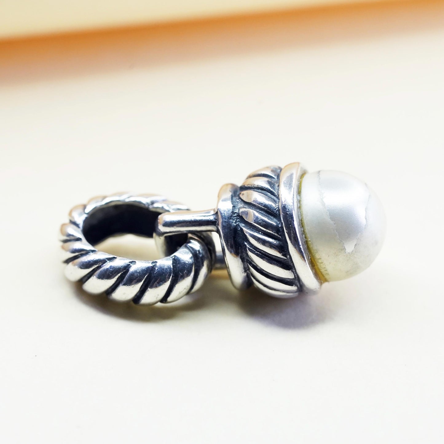 Vintage silver tone charm pendant with faux pearl and cable details
