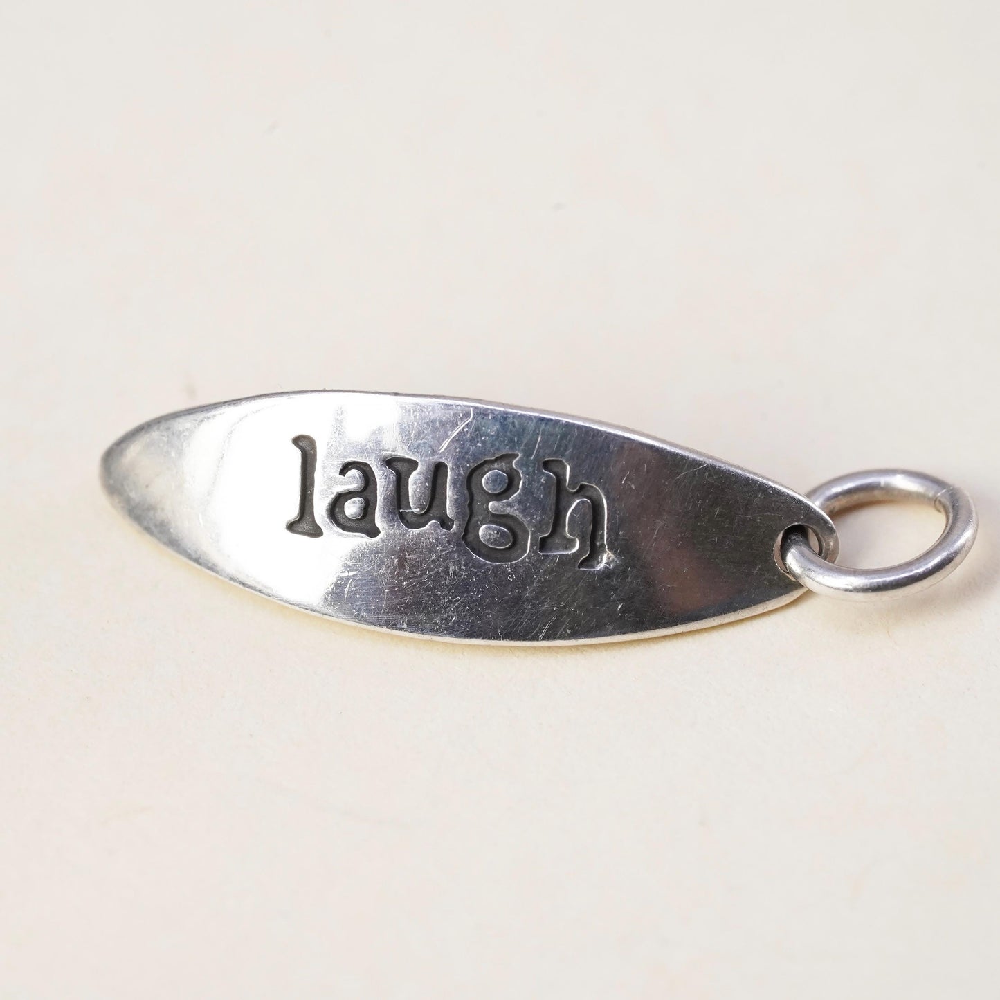 Vintage sterling silver tag charm embossed “laugh” 925 pendant, silver tested