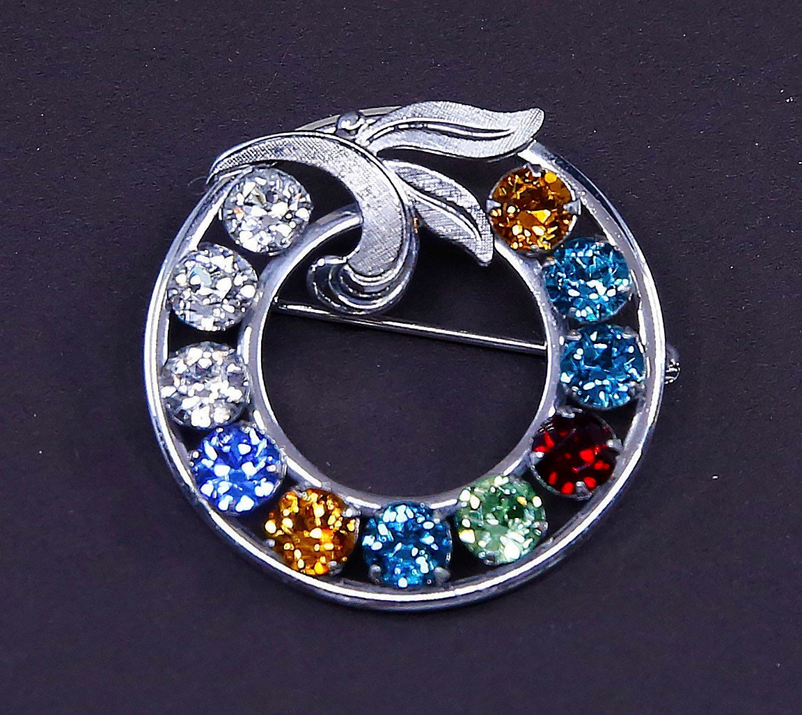 Vintage sterling 925 silver flower circle brooch with crystal and leaves