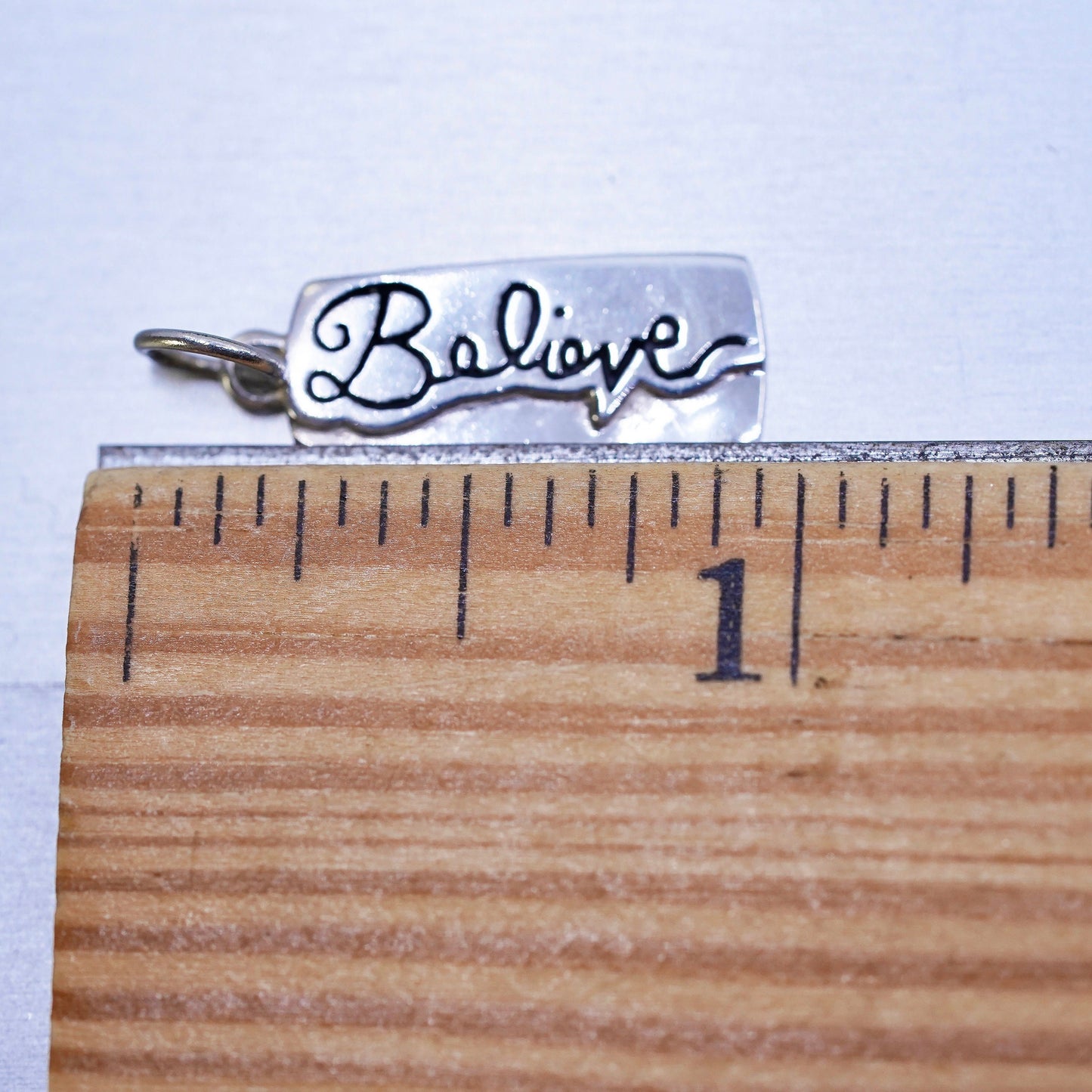 Vintage sterling silver charm, 925 silver tag with "believe" embossed