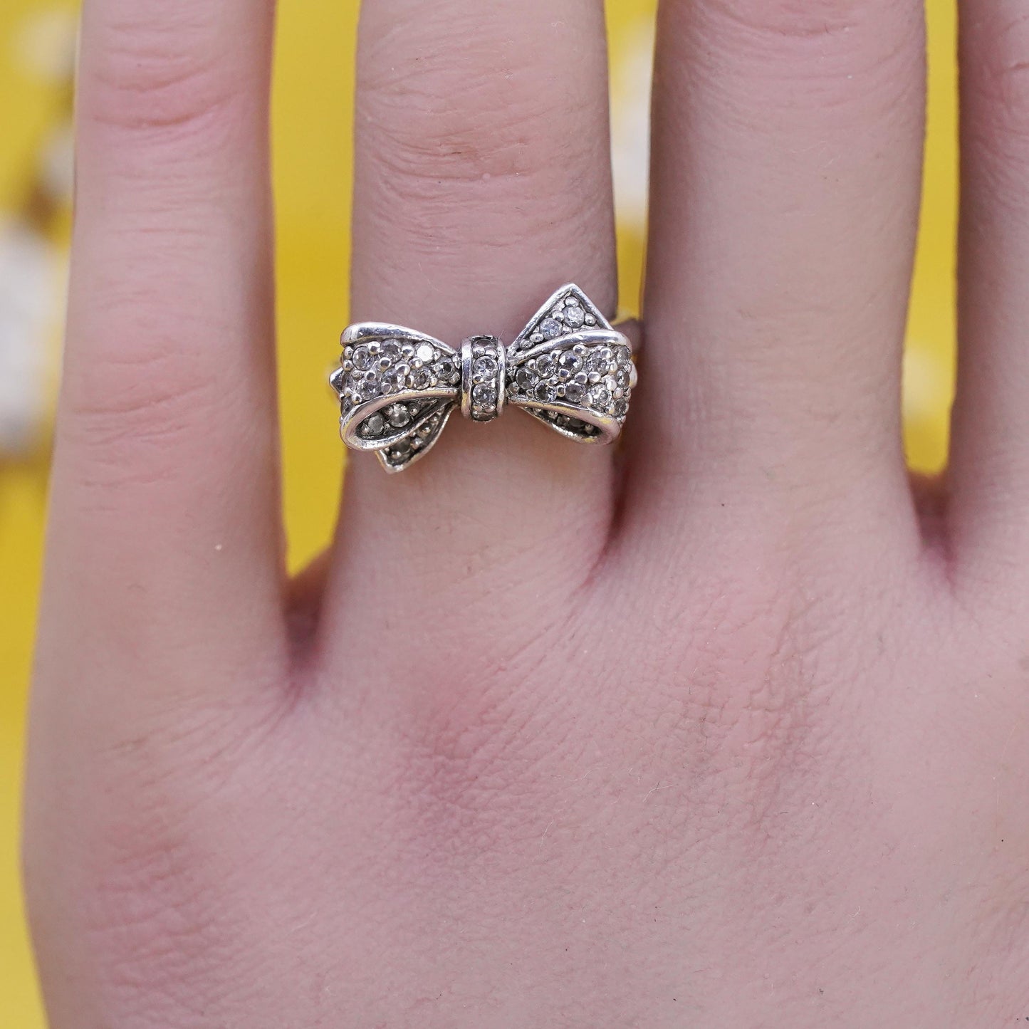 Size 6.75, vintage Sterling 925 silver ribbon bow tie ring with cluster cz