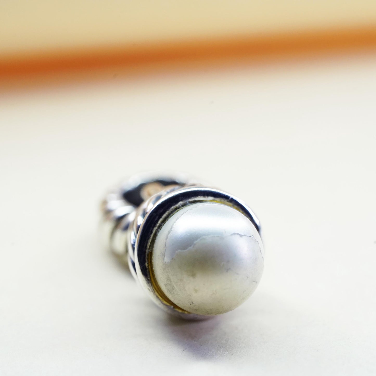 Vintage silver tone charm pendant with faux pearl and cable details