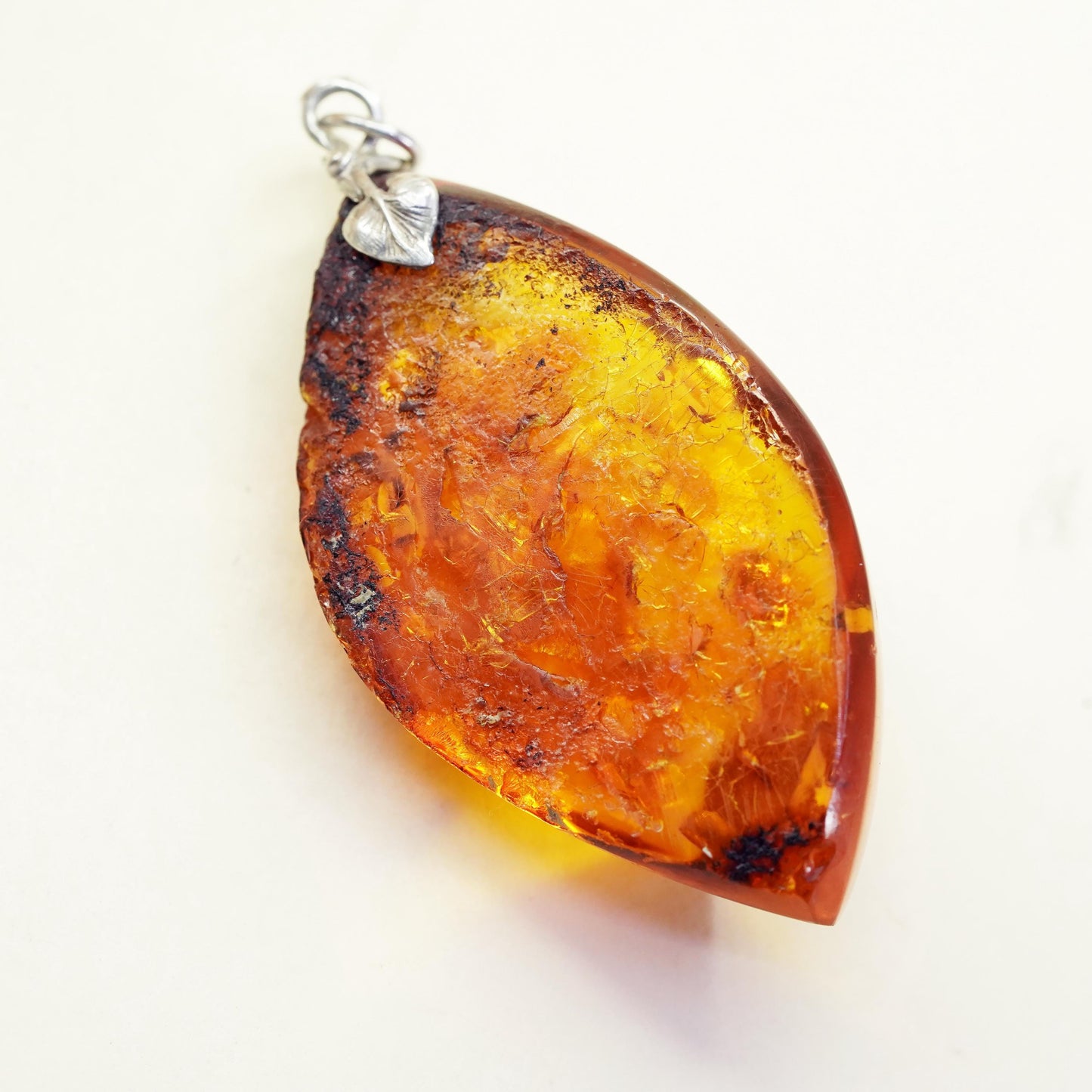 Vintage sterling 925 silver handmade pendant with amber nugget and leaf bail