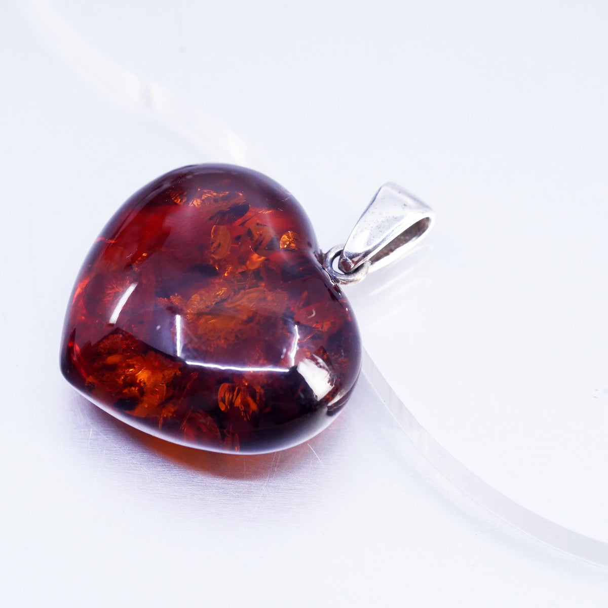 Vintage sterling 925 silver handmade pendant with heart amber