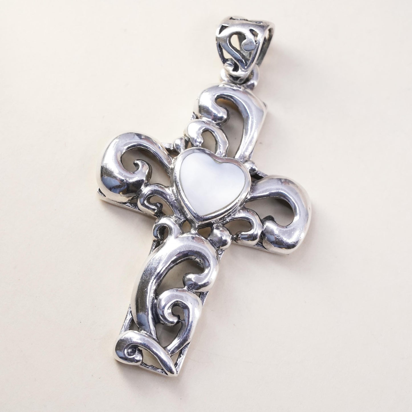 southwestern sterling silver pendant, swirly 925 cross heart mother of pearl