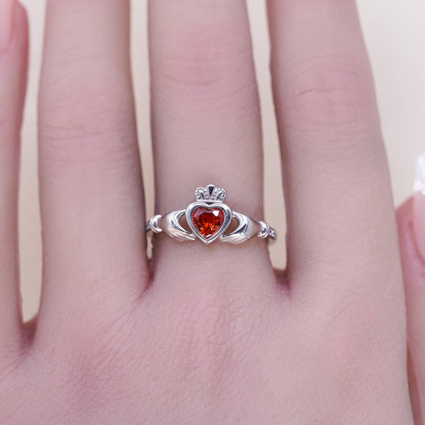 Size 8, Irish sterling 925 silver claddagh ring, holding heart, orange crystal