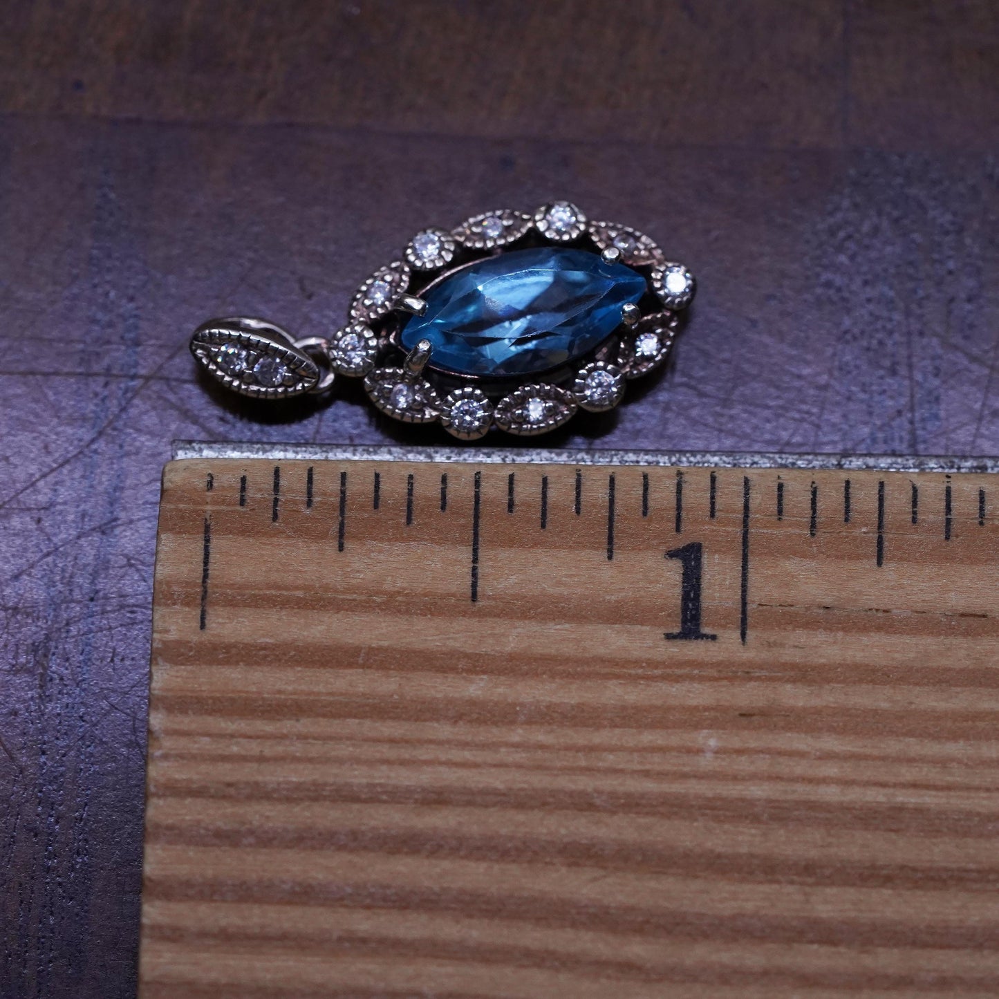 Vintage Sterling 925 silver handmade pendant with blue topaz and cz around
