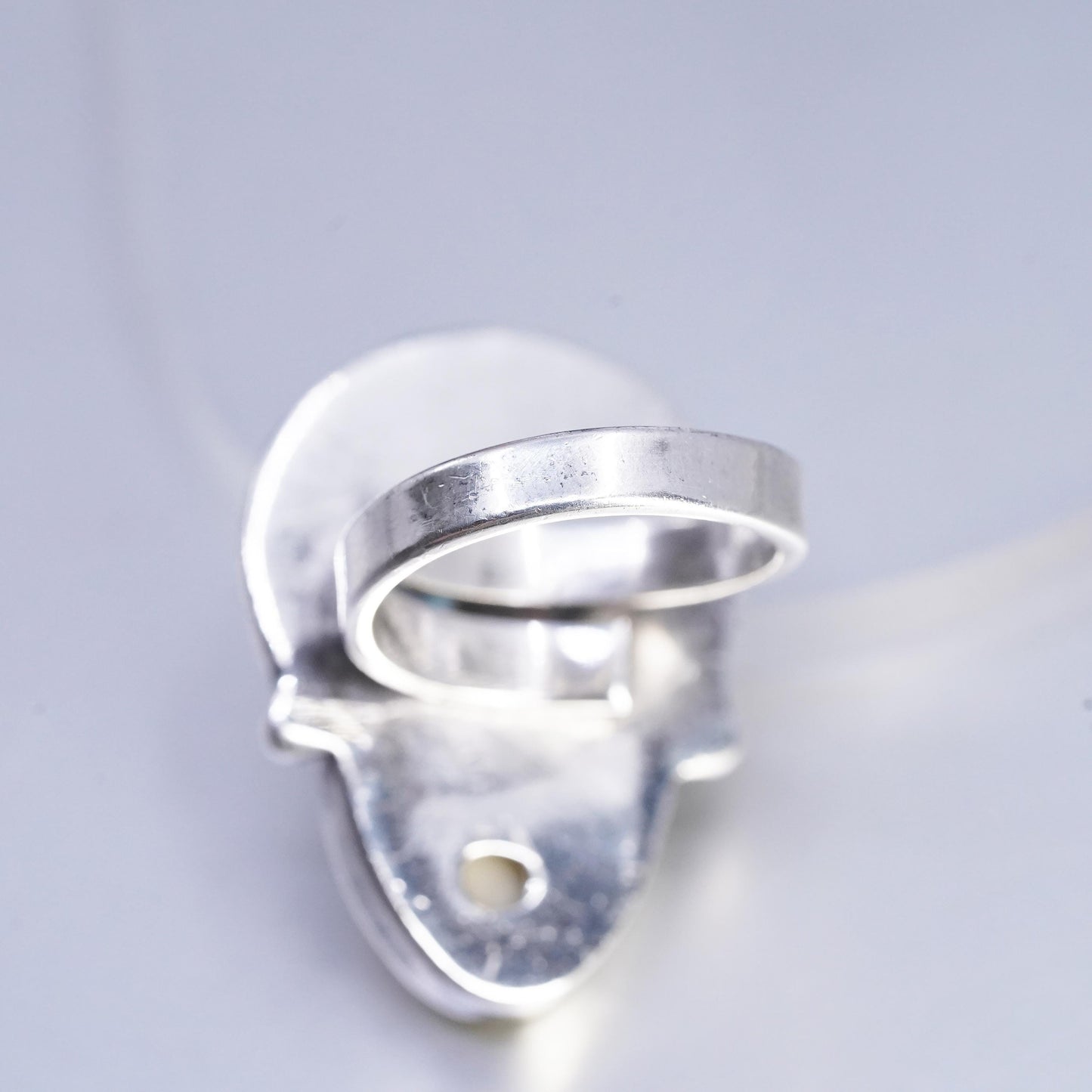 Size 7.5, vintage Sterling 925 silver ring with carved goddess face and garnet