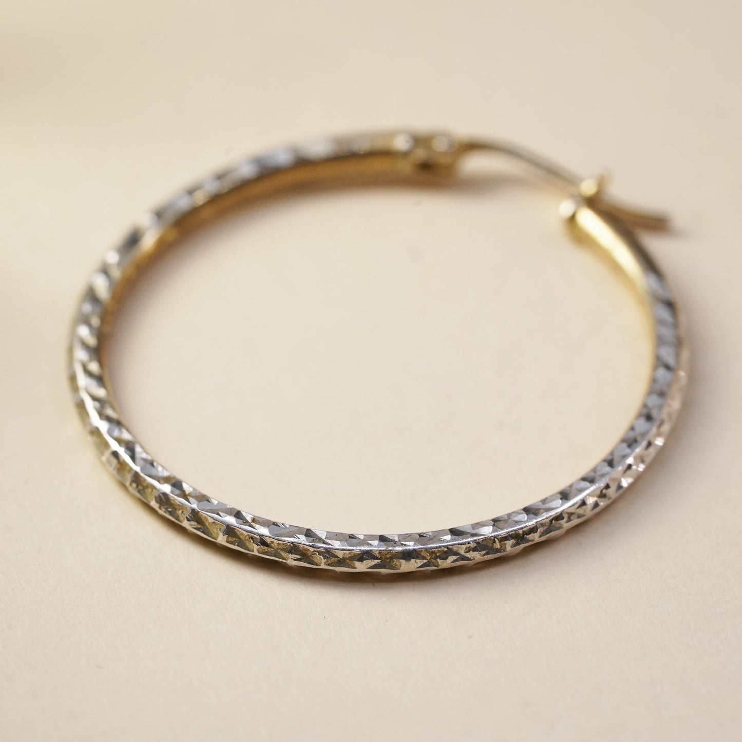 1.25", vermeil yellow gold over sterling silver single earring, textured hoop