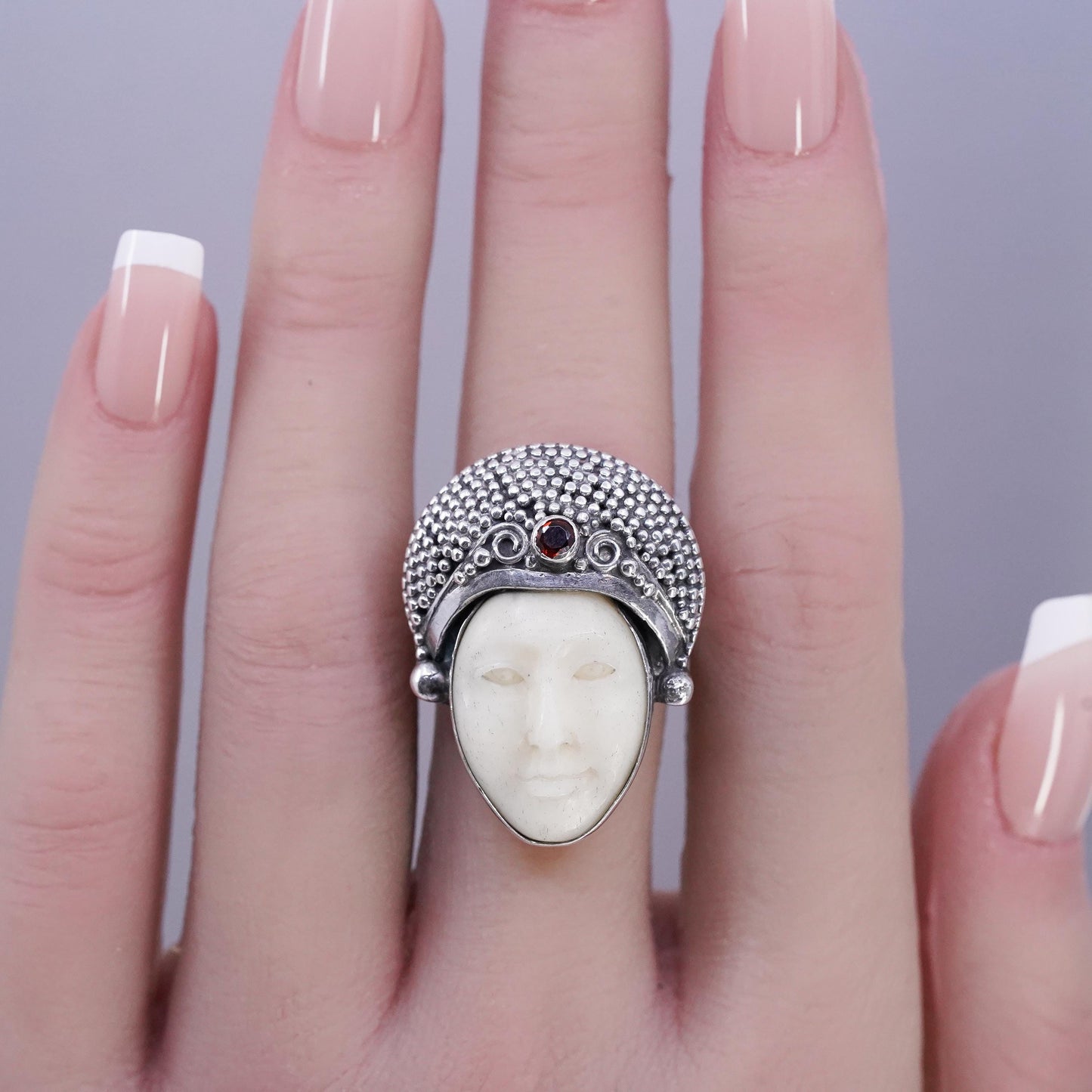 Size 7.5, vintage Sterling 925 silver ring with carved goddess face and garnet