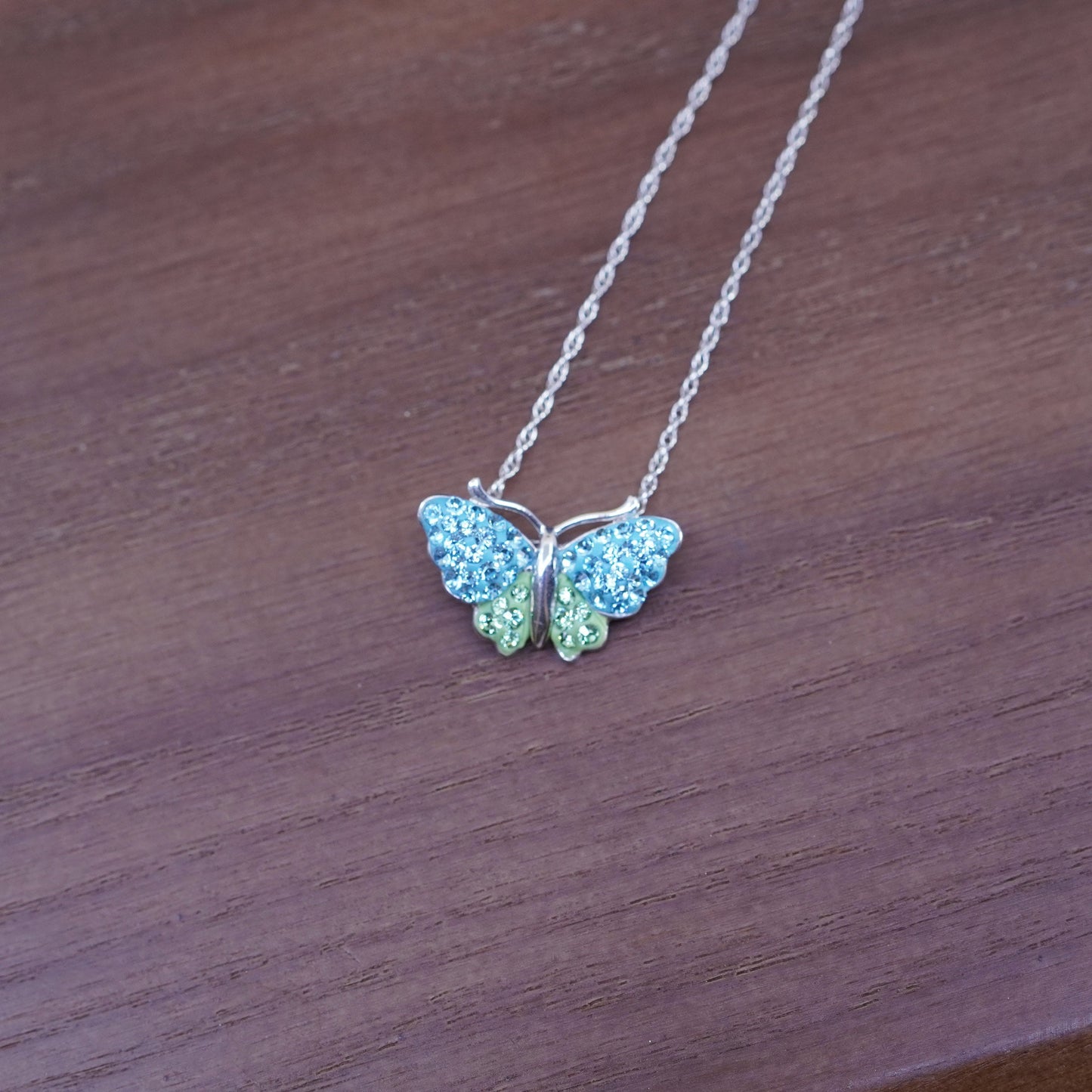 18”, Sterling silver necklace, 925 Singapore rope chain w/ butterfly pendant cz