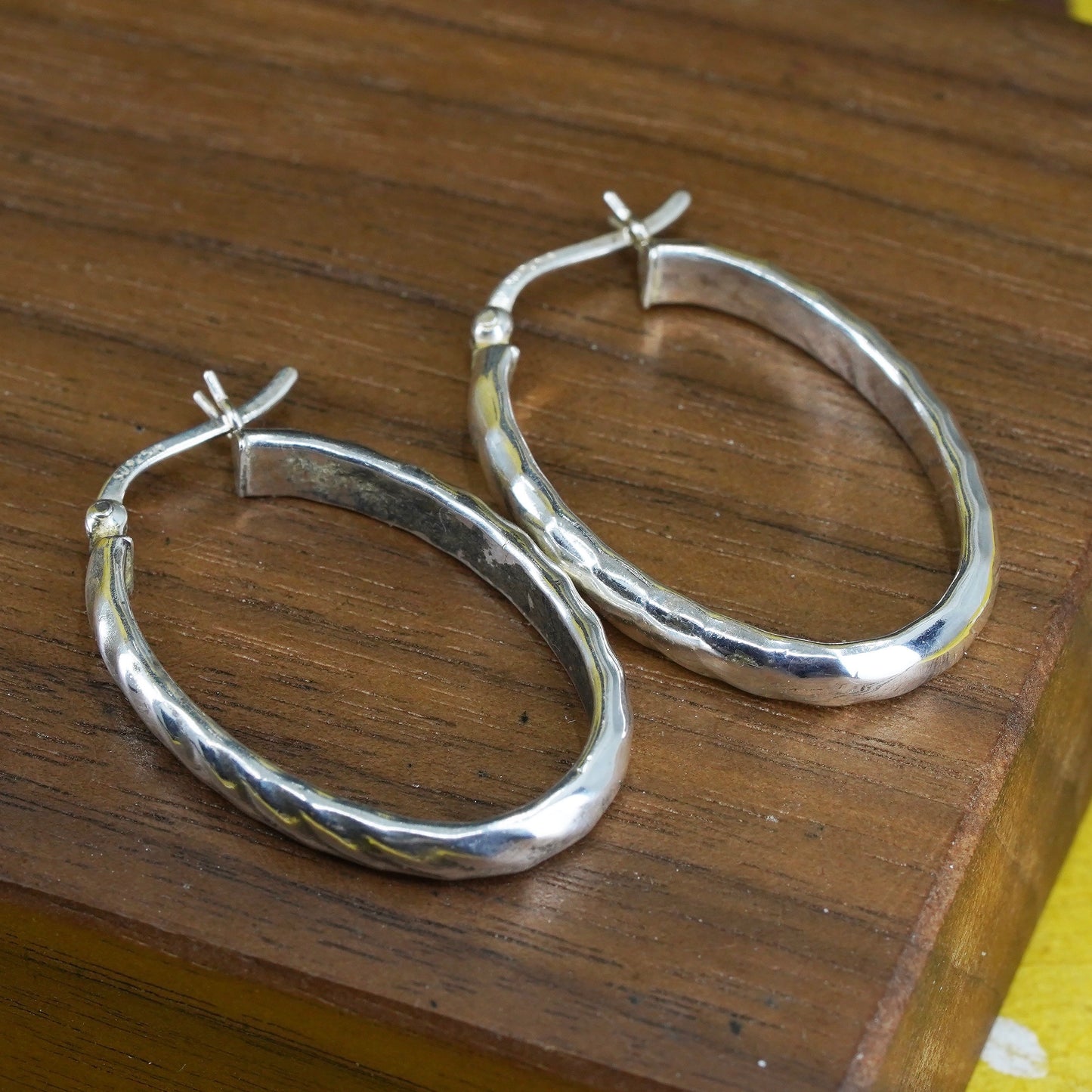 1.25", Sterling silver oval hoop earrings, textured 925 silver huggie