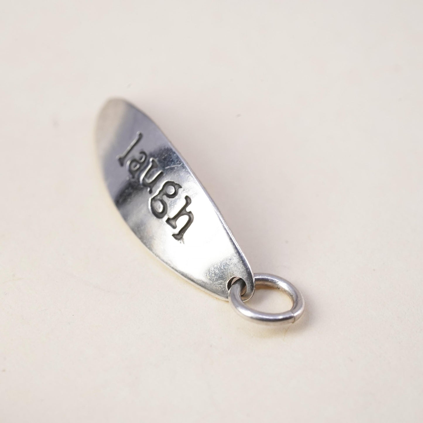 Vintage sterling silver tag charm embossed “laugh” 925 pendant, silver tested