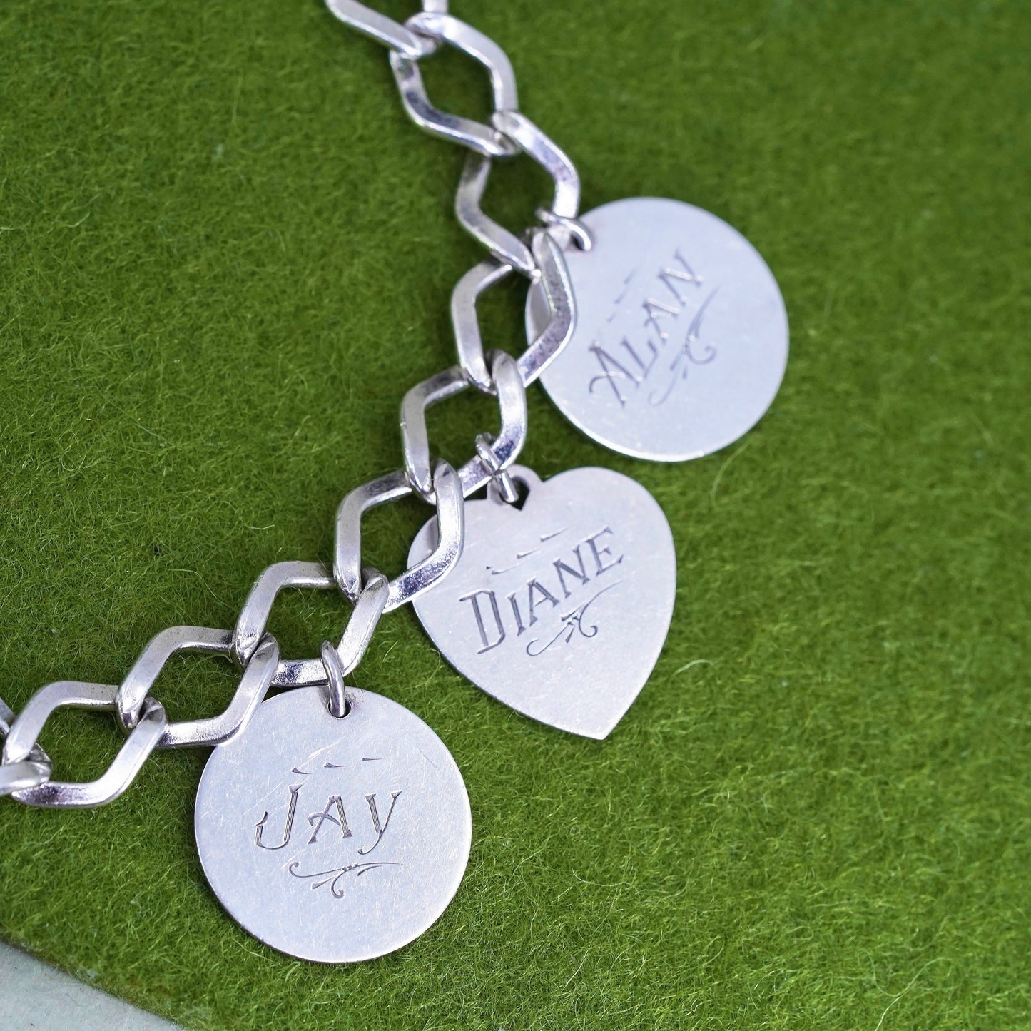 6.75" sterling silver bracelet, 925 curb link chain with charms embossed names