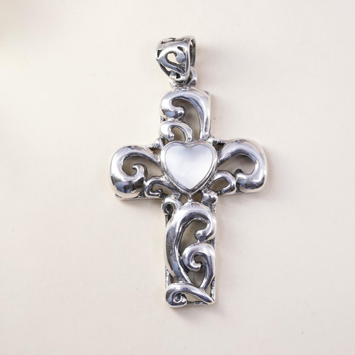 southwestern sterling silver pendant, swirly 925 cross heart mother of pearl