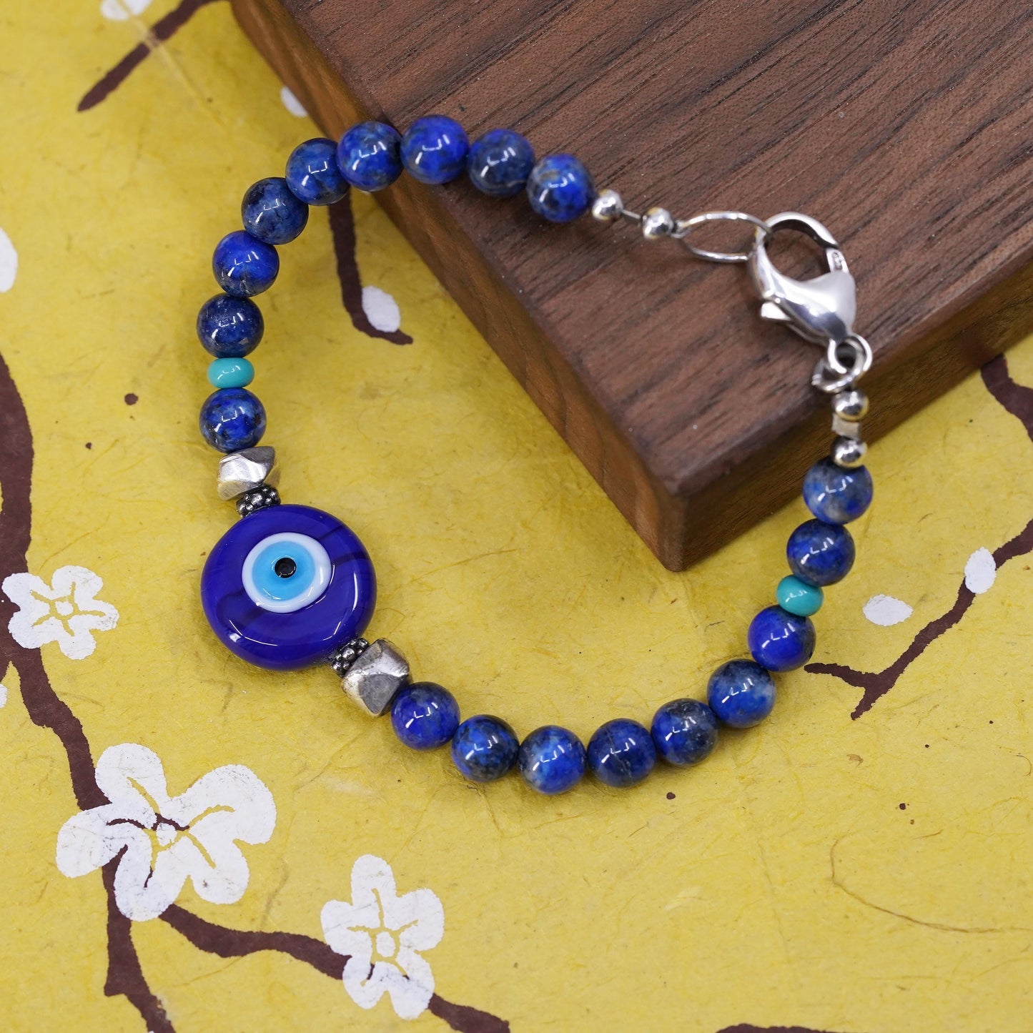 6.75", vintage sterling silver bracelet with blue evil eye lapis lazuli beads