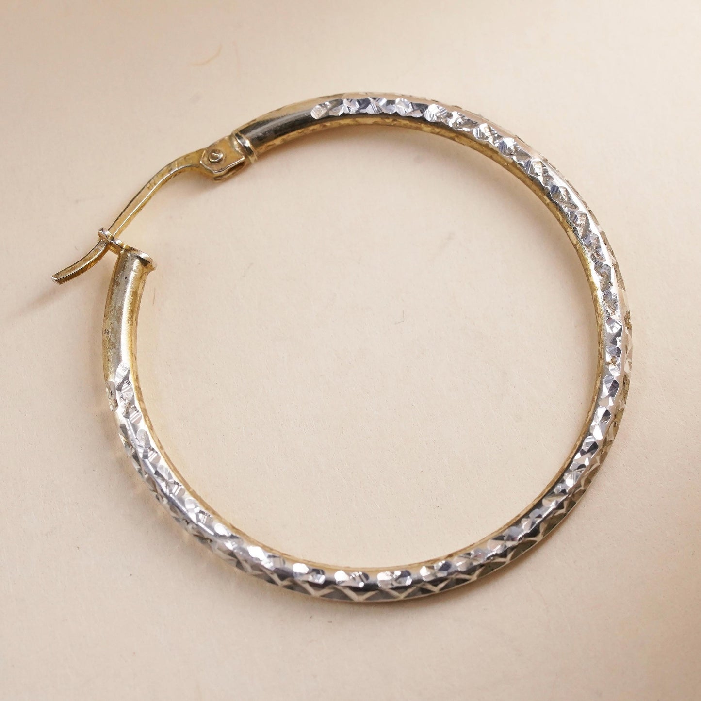 1.25", vermeil yellow gold over sterling silver single earring, textured hoop