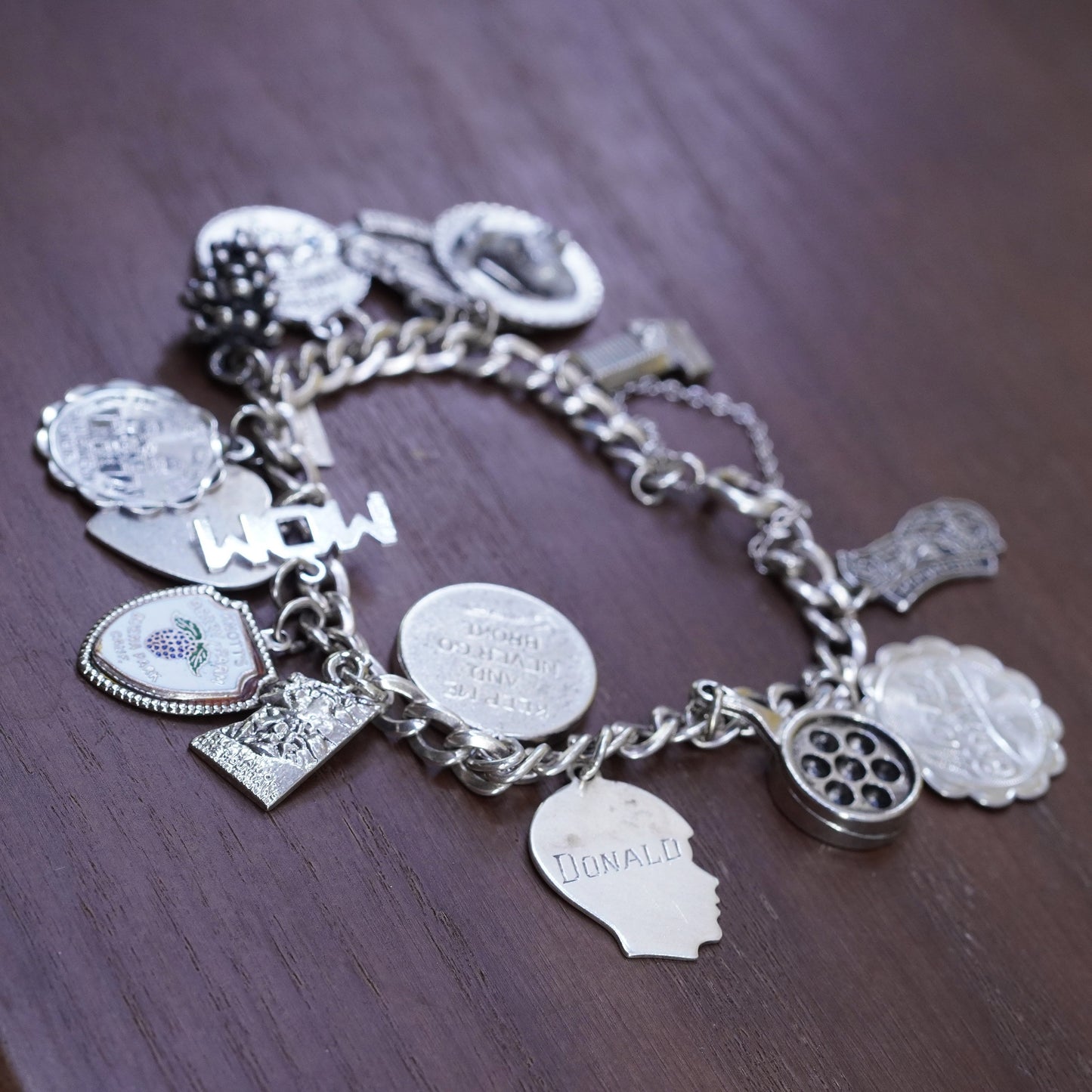 7”, vintage Sterling silver handmade bracelet, 925 curb chain with 15 charms