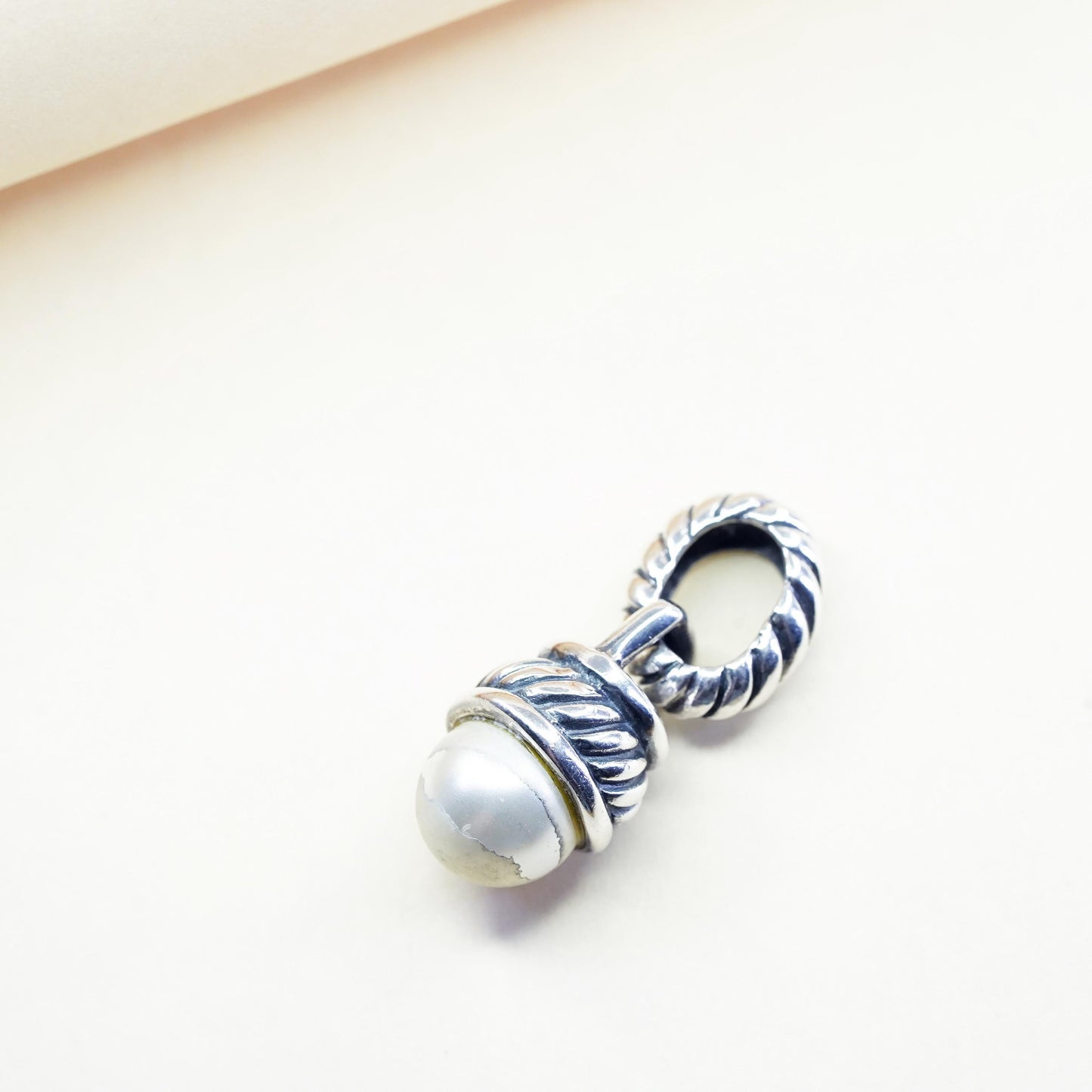Vintage silver tone charm pendant with faux pearl and cable details