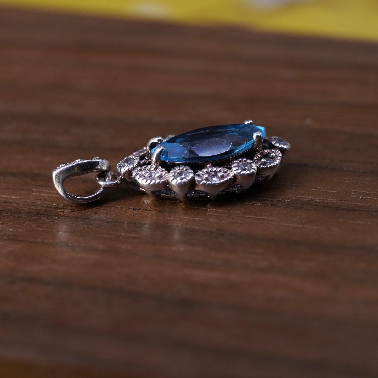 Vintage Sterling 925 silver handmade pendant with blue topaz and cz around