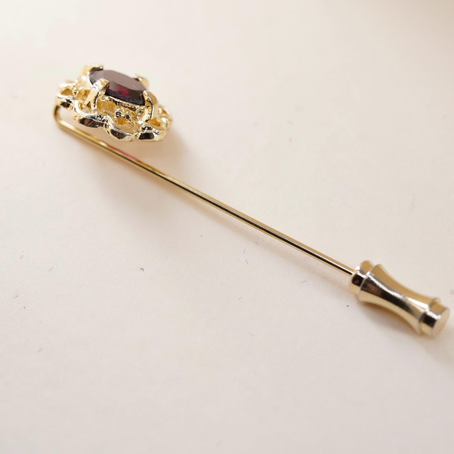 Vintage gold tone pin with garnet