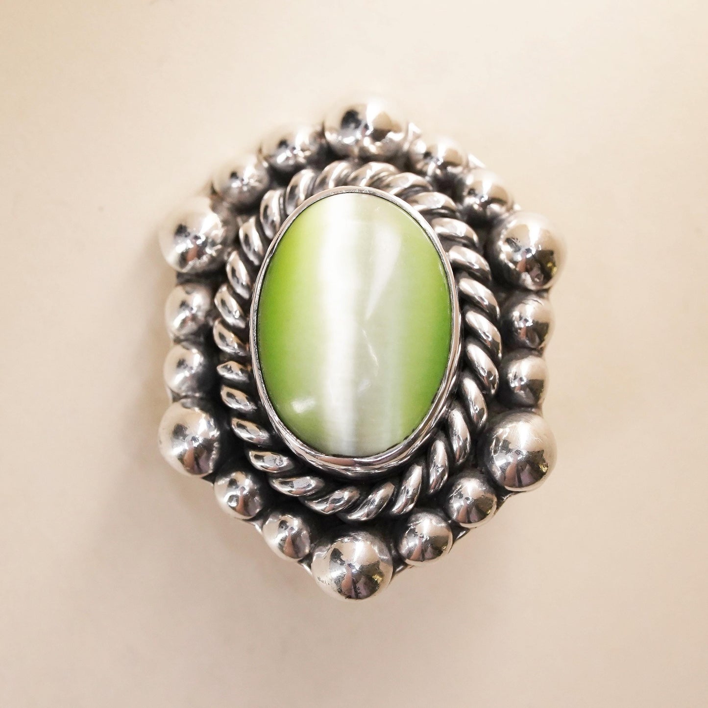 Mexican sterling silver single earring, 925 silver clip on with green cat’s eye
