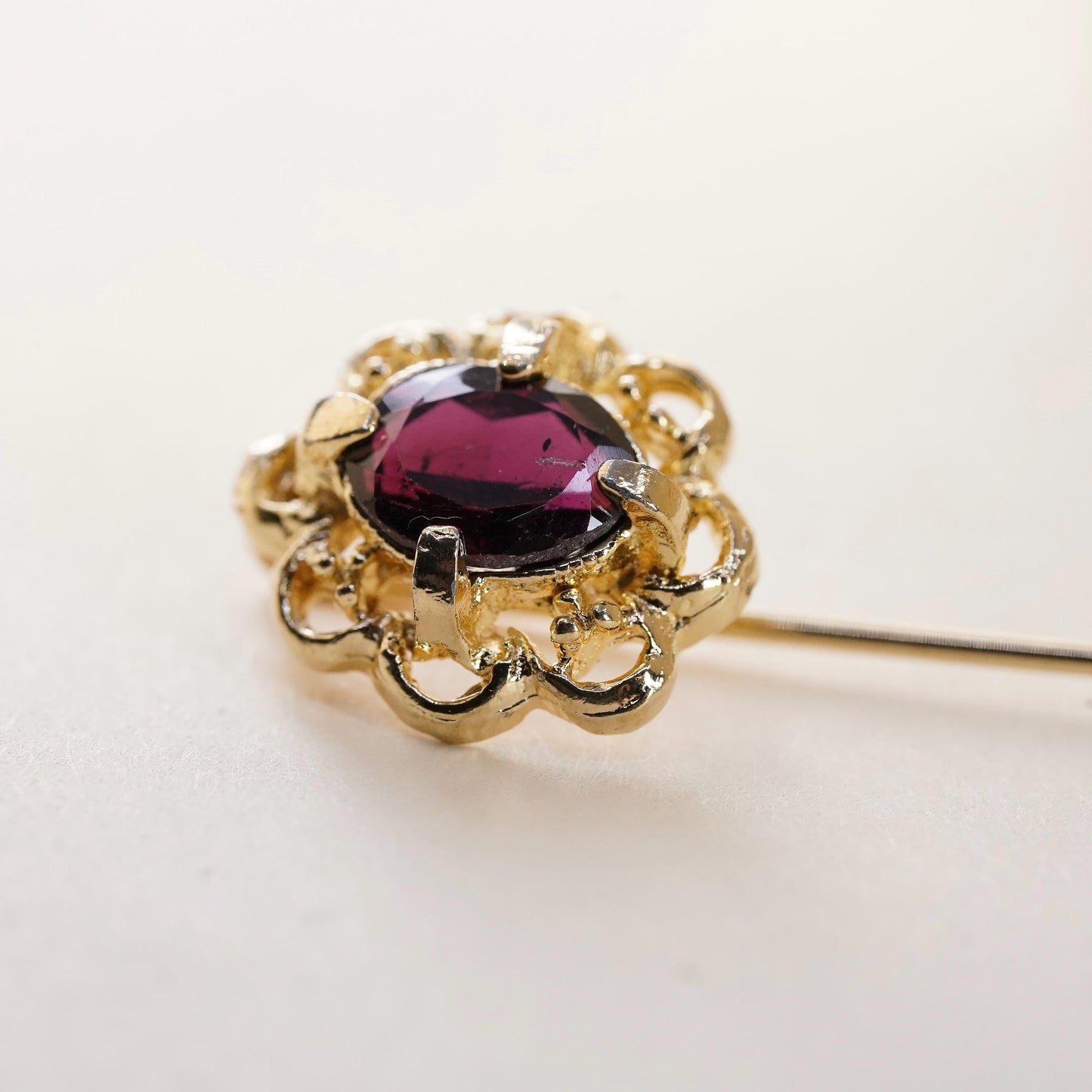 Vintage gold tone pin with garnet