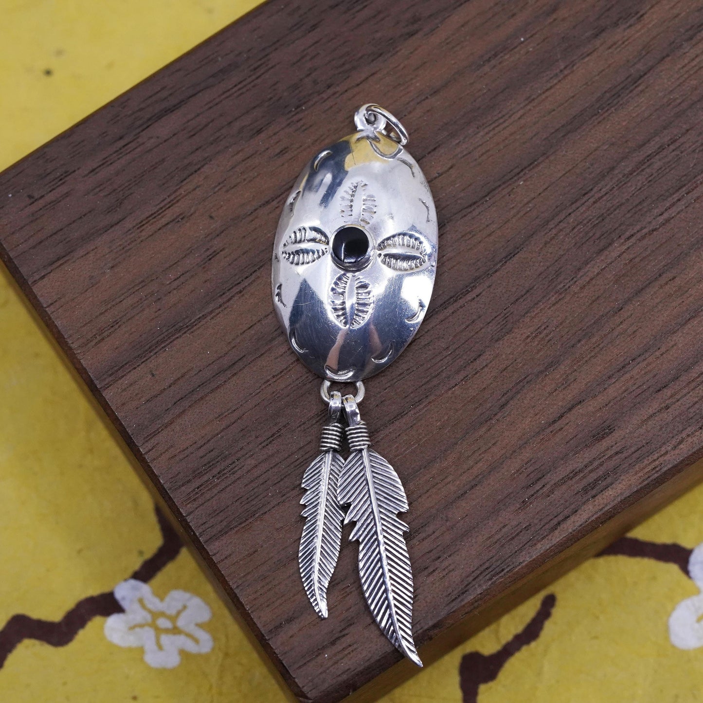 Sterling silver pendant, southwestern style, 2” 925 circle with feather dangle