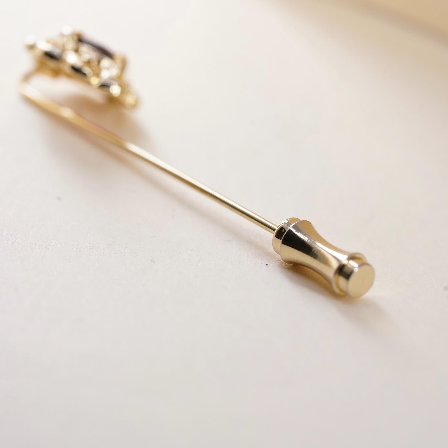 Vintage gold tone pin with garnet