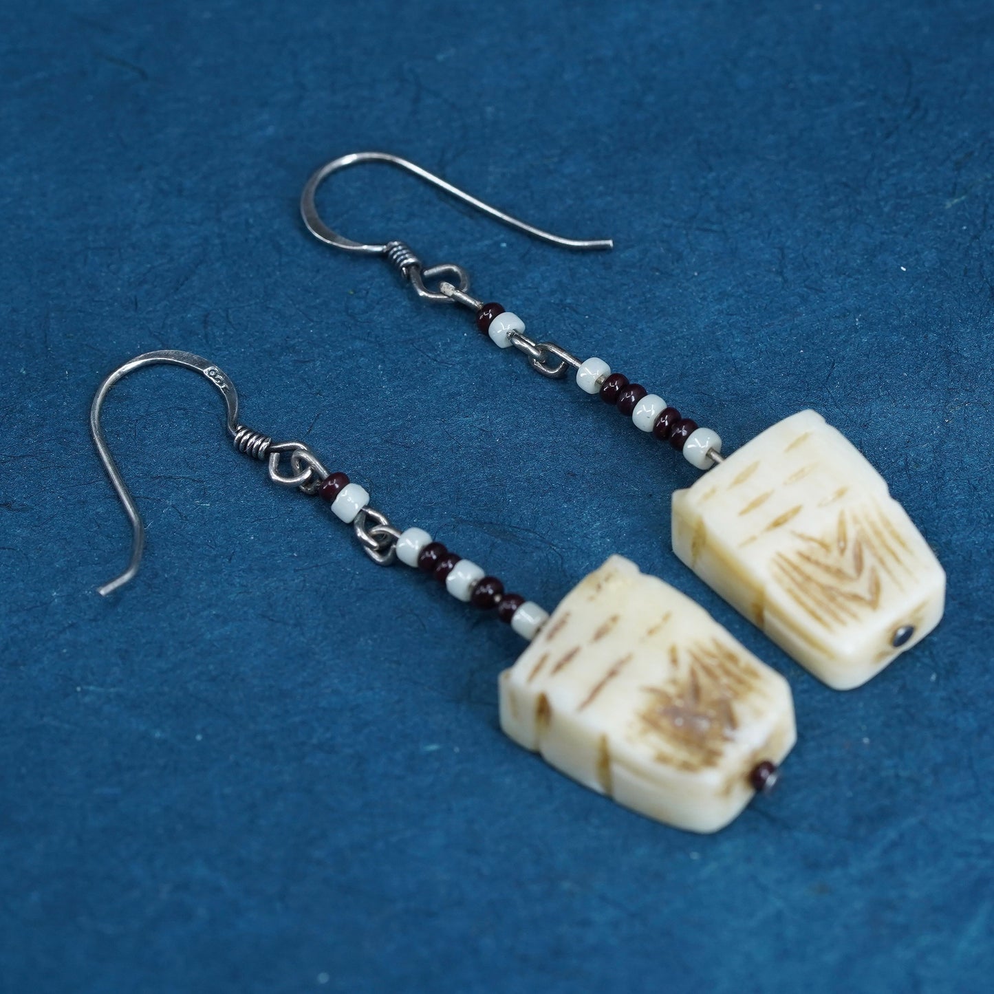 Vintage southwestern sterling silver handmade earrings with carved seed dangles