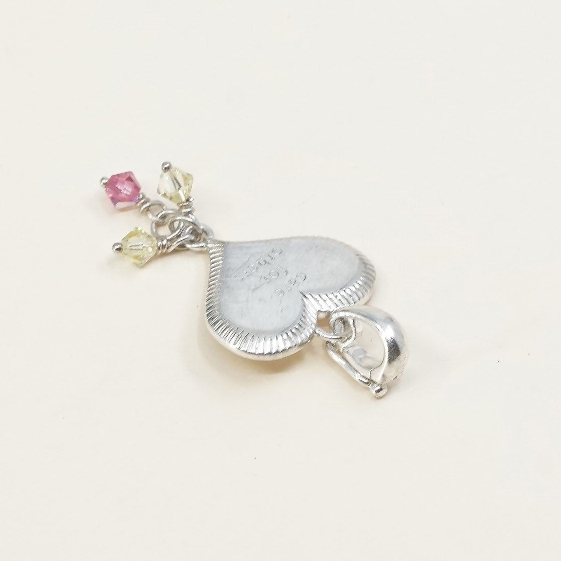 handmade sterling silver heart charm embossed “care for others”, 925 pendant