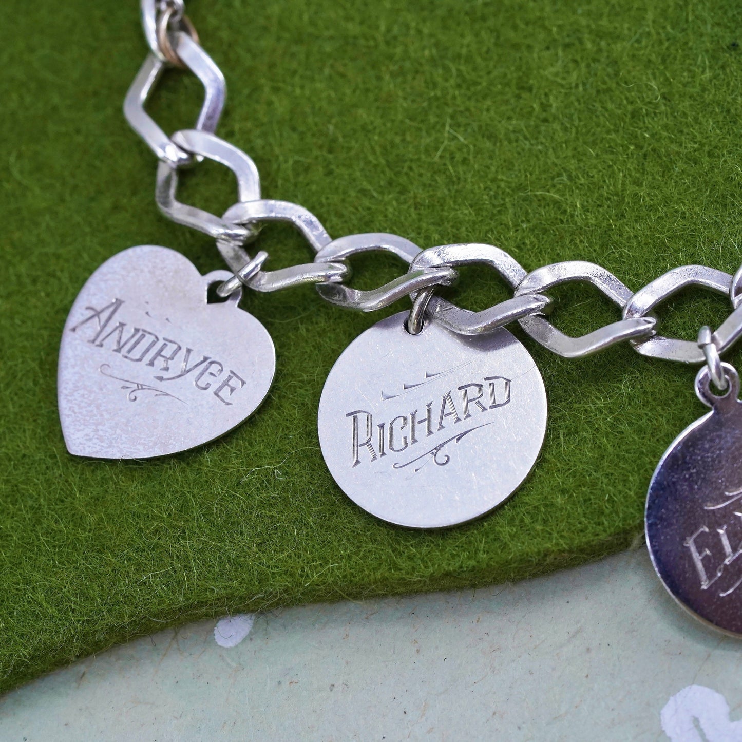 6.75" sterling silver bracelet, 925 curb link chain with charms embossed names