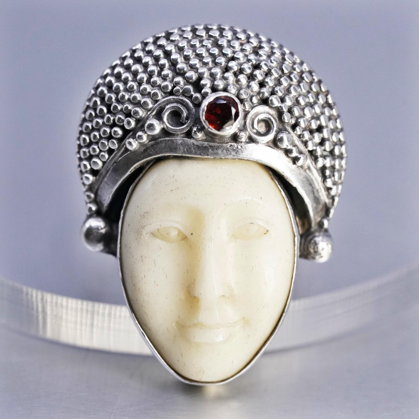 Size 7.5, vintage Sterling 925 silver ring with carved goddess face and garnet