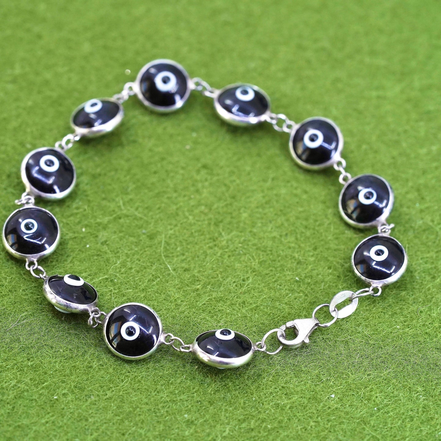 6.75”, vintage handmade sterling silver bracelet, black glass evil eye beads