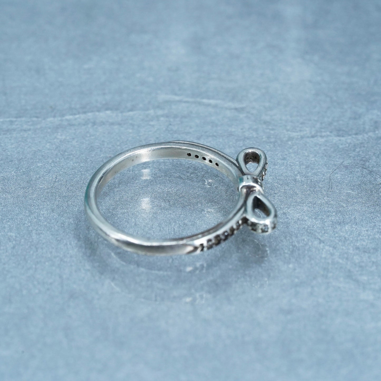 Size 7.25, ALE fashionable Sterling 925 silver ribbon ring w/ cluster cz, band