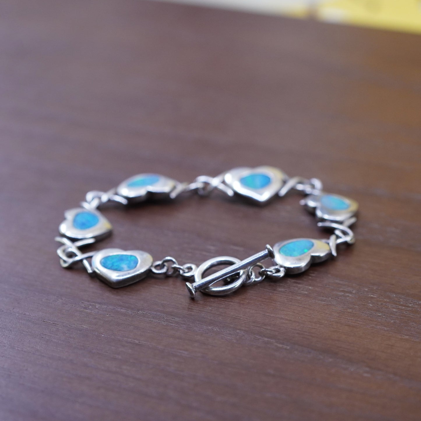 5.75”, vintage Sterling 925 silver heart chain bracelet w/ blue fire opal inlay