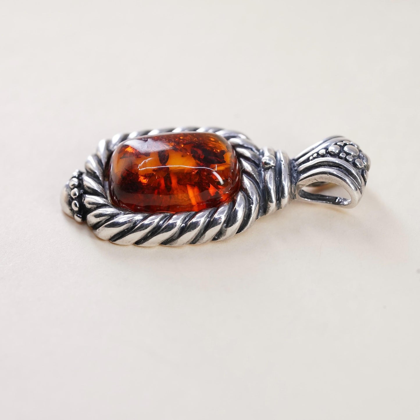 Vintage Sterling 925 silver handmade pendant with amber and cable around